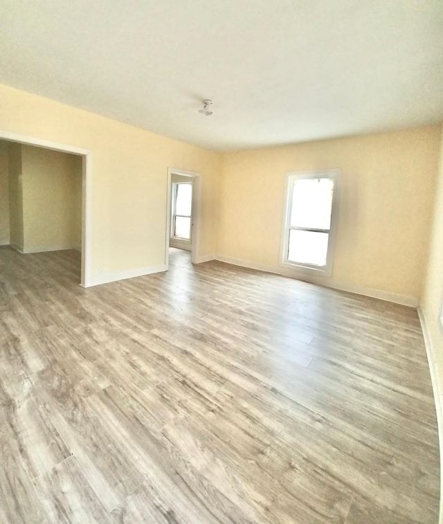 unfurnished room featuring light wood-type flooring