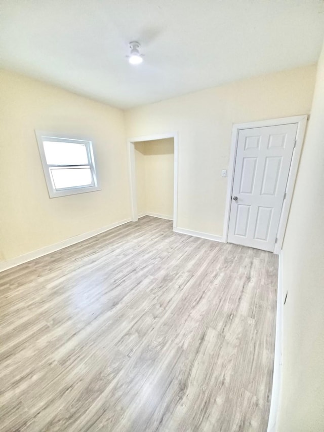 unfurnished bedroom with light hardwood / wood-style flooring