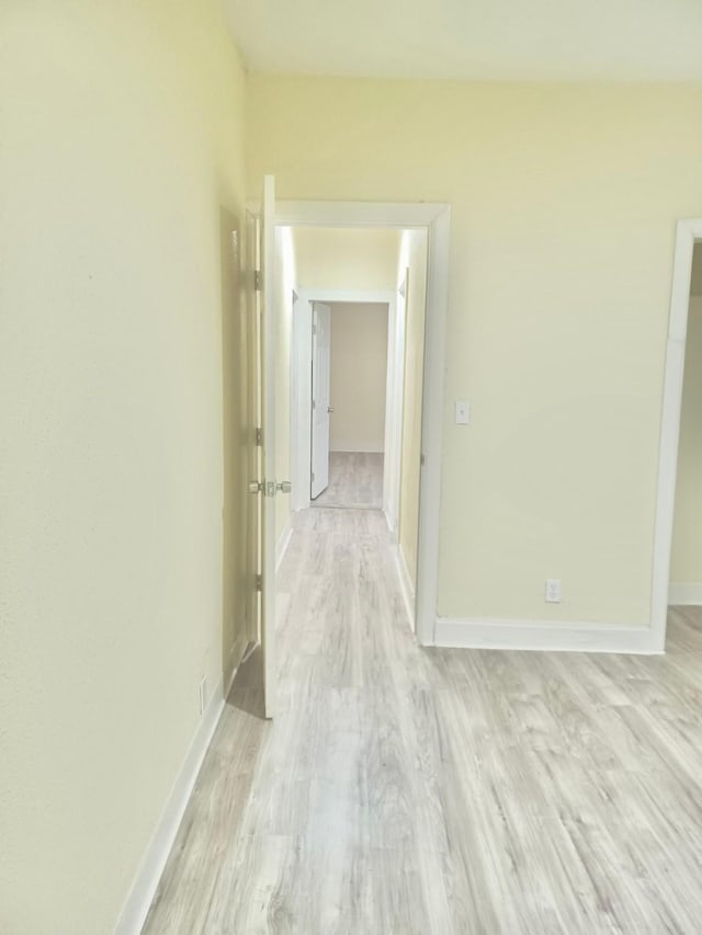 hallway with light wood-type flooring