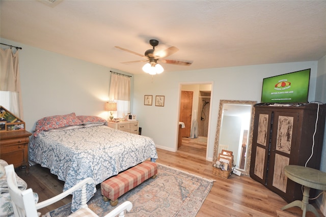 bedroom featuring ceiling fan and light hardwood / wood-style floors