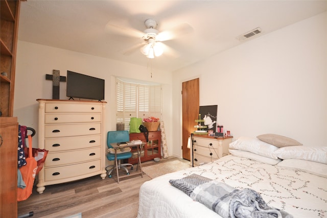 bedroom with light wood-type flooring and ceiling fan