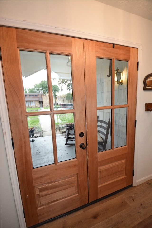 entryway with hardwood / wood-style flooring