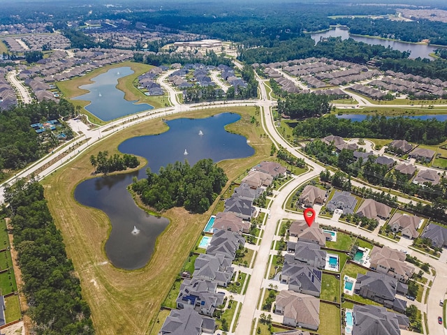 bird's eye view with a water view