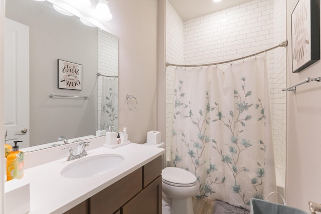 full bathroom with shower / bath combination with curtain, vanity, and toilet