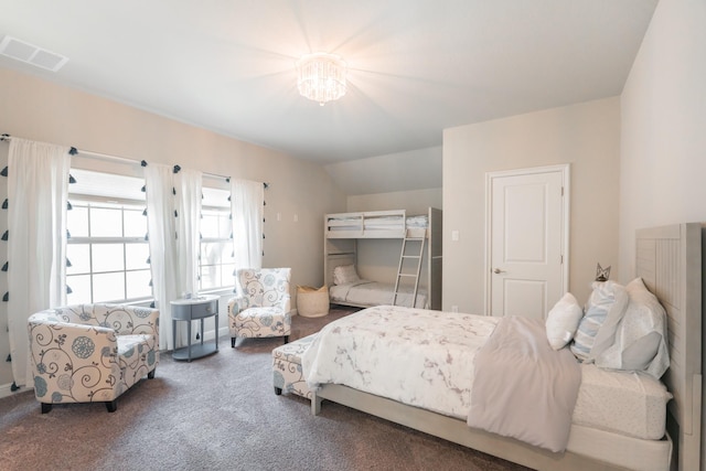 carpeted bedroom with lofted ceiling