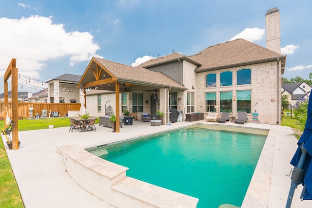 exterior space with an outdoor living space, ceiling fan, a fenced in pool, and a patio