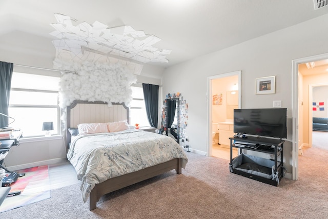 bedroom with carpet flooring and ensuite bath