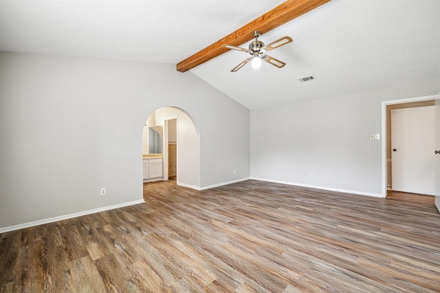 unfurnished living room with vaulted ceiling with beams, ceiling fan, and dark wood-type flooring