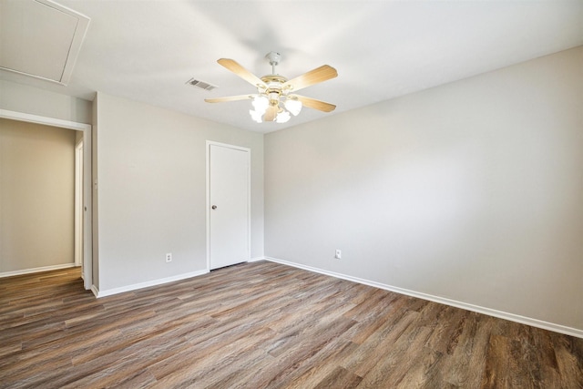 unfurnished bedroom featuring ceiling fan and dark hardwood / wood-style flooring