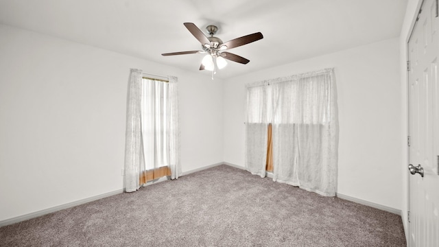 empty room featuring light carpet and ceiling fan