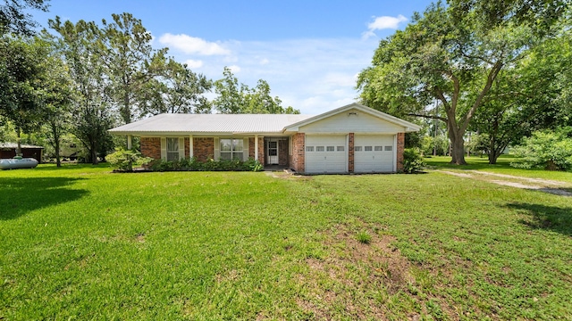 ranch-style house featuring a garage and a front lawn