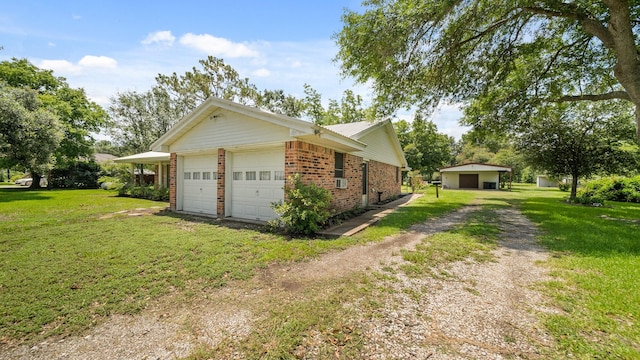 view of home's exterior featuring a garage and a yard