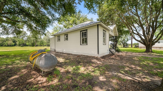 view of home's exterior featuring a yard