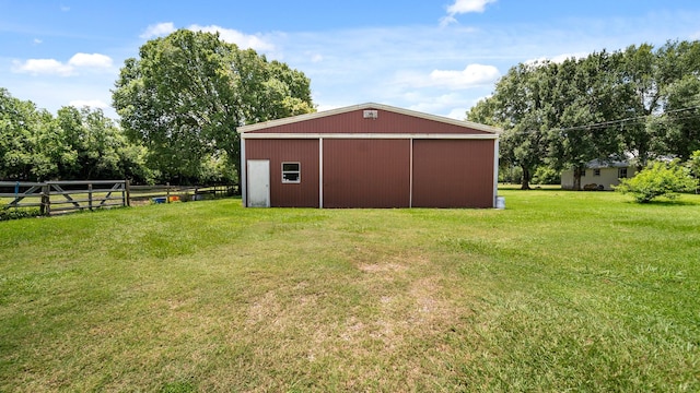 view of outdoor structure with a lawn