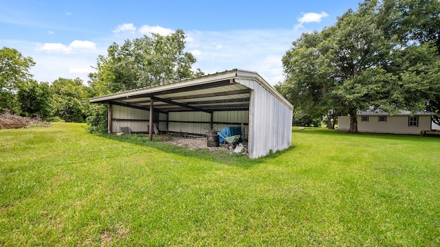 view of outbuilding featuring a yard