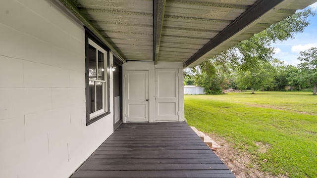 wooden deck with a yard