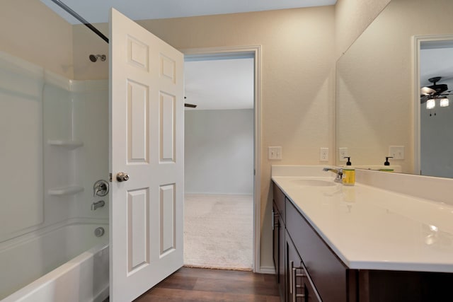 bathroom with vanity, ceiling fan, shower / bathing tub combination, and hardwood / wood-style flooring