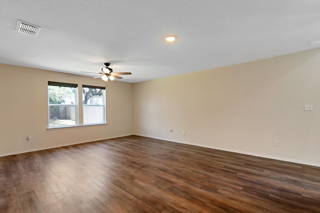 unfurnished room featuring dark hardwood / wood-style floors, a textured ceiling, and ceiling fan