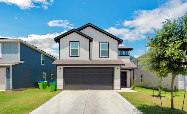 view of front of property with a front yard and a garage