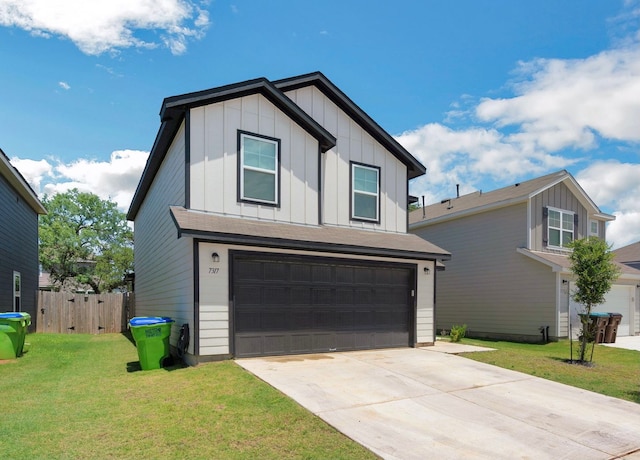 view of front facade with a front lawn and a garage