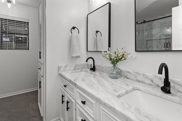 bathroom with vanity and a shower with shower door