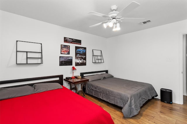 bedroom featuring ceiling fan and wood-type flooring