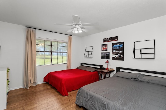 bedroom featuring hardwood / wood-style flooring and ceiling fan