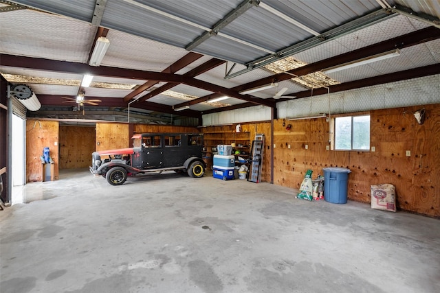 garage featuring wooden walls