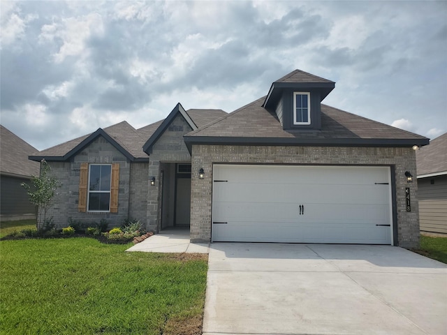 view of front of home with a garage, concrete driveway, stone siding, a front lawn, and brick siding