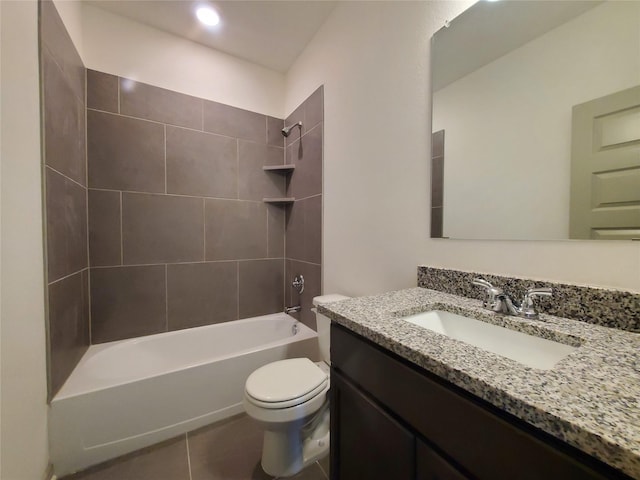 bathroom featuring toilet, tile patterned floors, washtub / shower combination, and vanity