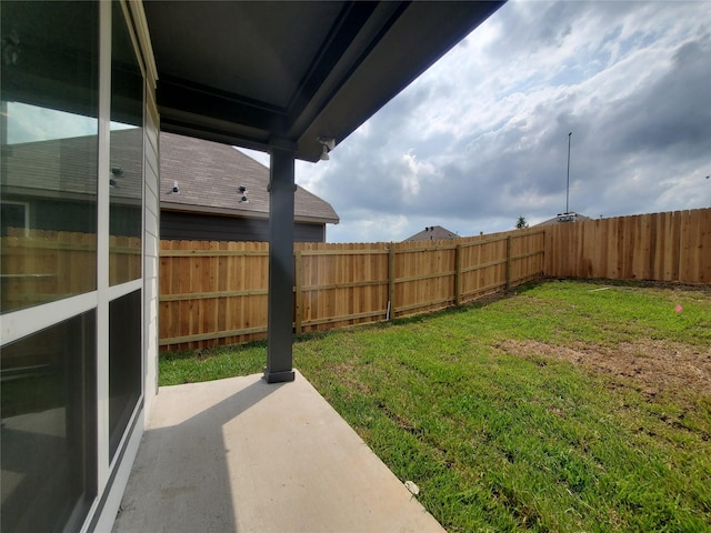 view of yard featuring a patio area and a fenced backyard