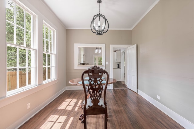 dining space with a notable chandelier, dark wood-type flooring, and plenty of natural light