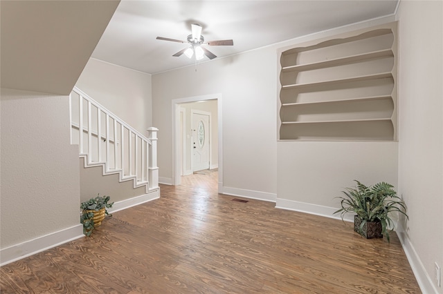 unfurnished room featuring ceiling fan and hardwood / wood-style floors