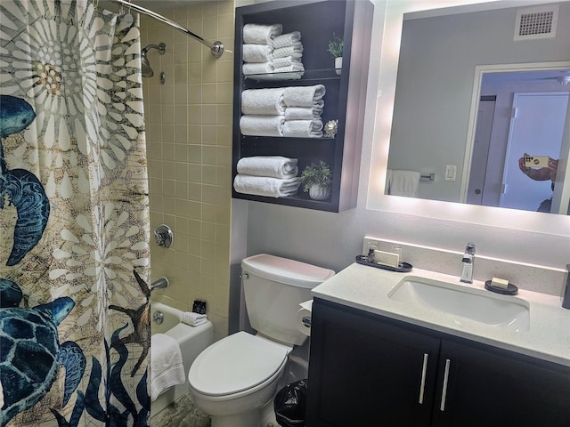 full bathroom featuring shower / bath combo, vanity, and toilet