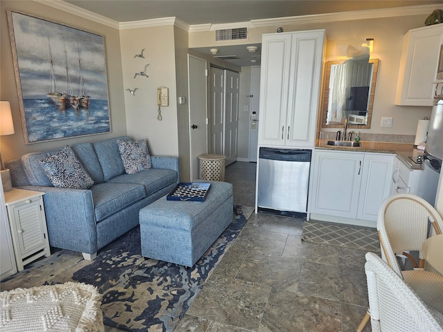 living room with ornamental molding and sink