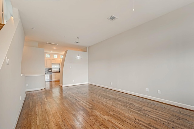 unfurnished living room featuring light hardwood / wood-style flooring