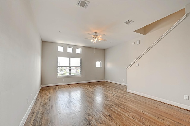 spare room with ceiling fan and light hardwood / wood-style floors