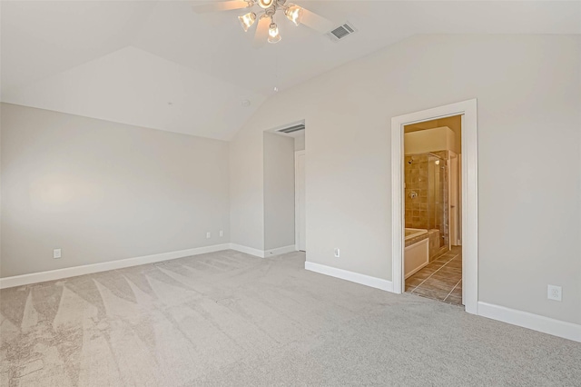 unfurnished bedroom with light carpet, ensuite bath, ceiling fan, and lofted ceiling