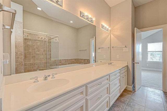 bathroom featuring tile patterned flooring, vanity, and independent shower and bath