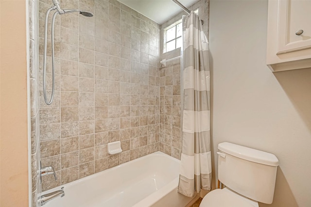 bathroom featuring toilet and shower / bathtub combination with curtain