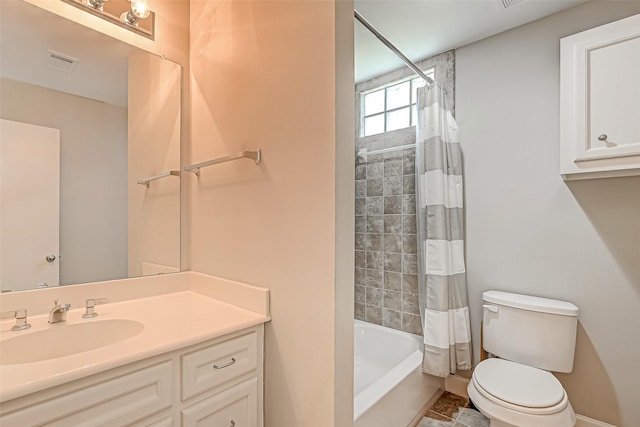 full bathroom featuring vanity, toilet, and shower / bath combo with shower curtain