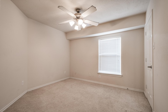 unfurnished room with light carpet and ceiling fan