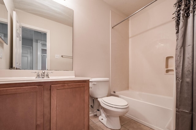 full bathroom with tile patterned floors, a textured ceiling, vanity, shower / bath combo with shower curtain, and toilet