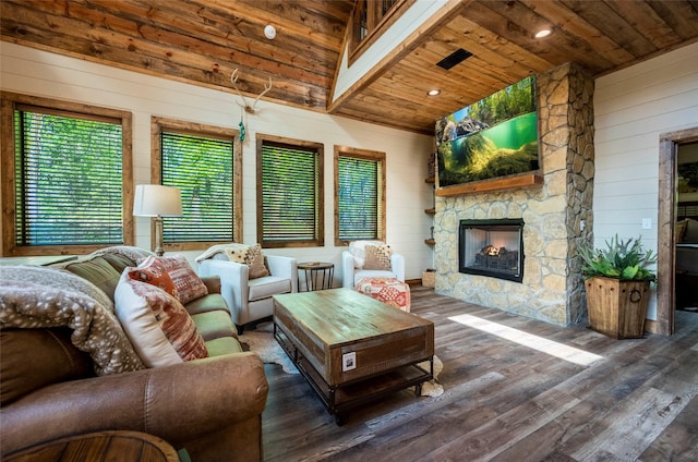 living area featuring wooden ceiling, an outdoor stone fireplace, and wood finished floors