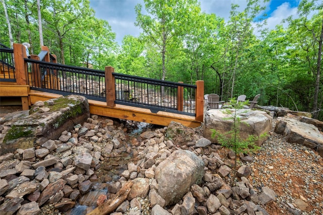 wooden terrace with a forest view