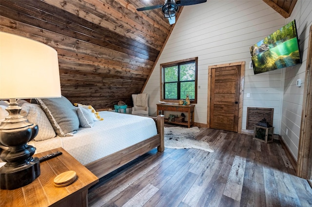 bedroom with wood walls, wood ceiling, a ceiling fan, vaulted ceiling, and wood-type flooring