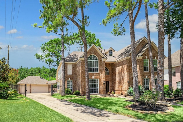 view of front property featuring an outbuilding, a garage, and a front lawn