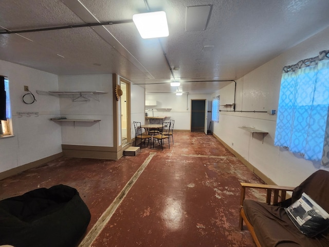 basement featuring a textured ceiling