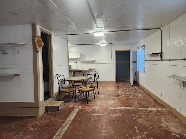 dining space featuring a textured ceiling