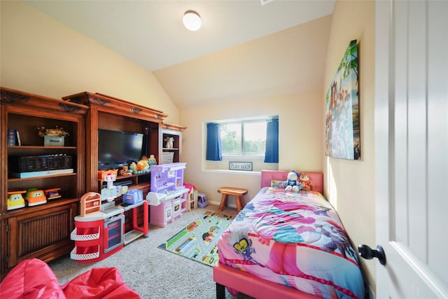 bedroom featuring vaulted ceiling and carpet floors